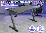 Z8-140 Z-Shaped RGB Gaming Desk – 140×60×73 cm Carbon-Fibre Surface, Dual Cable Grommets, Cup & Headphone Holders, Steel Frame Stability, Customizable RGB Edge Lighting
